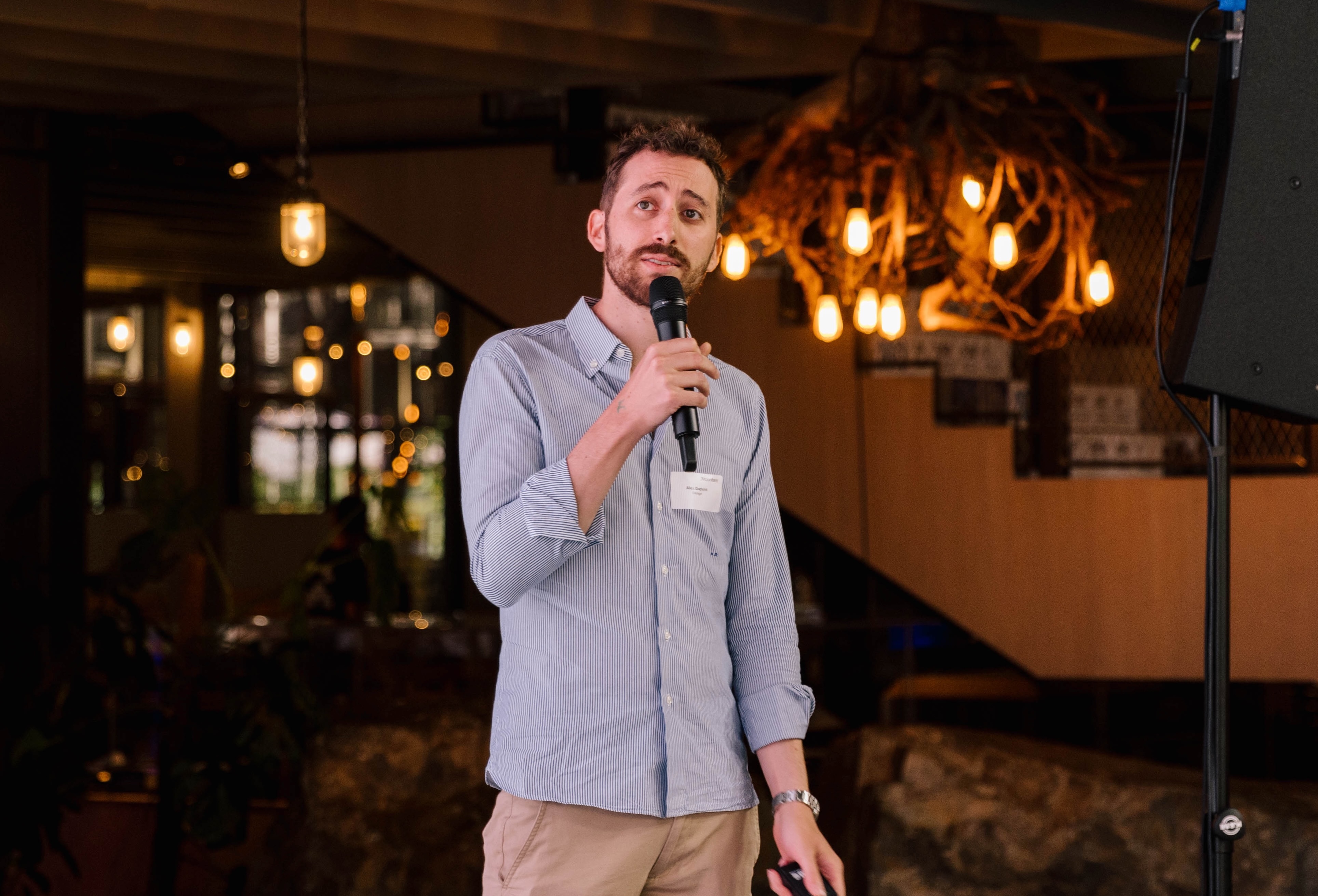 Alex Dapunt speaking on a stage